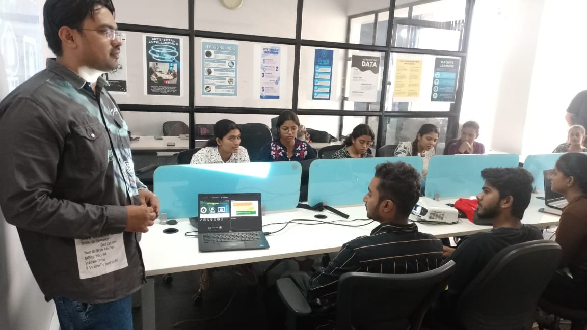 Mentor guiding student in computer lab